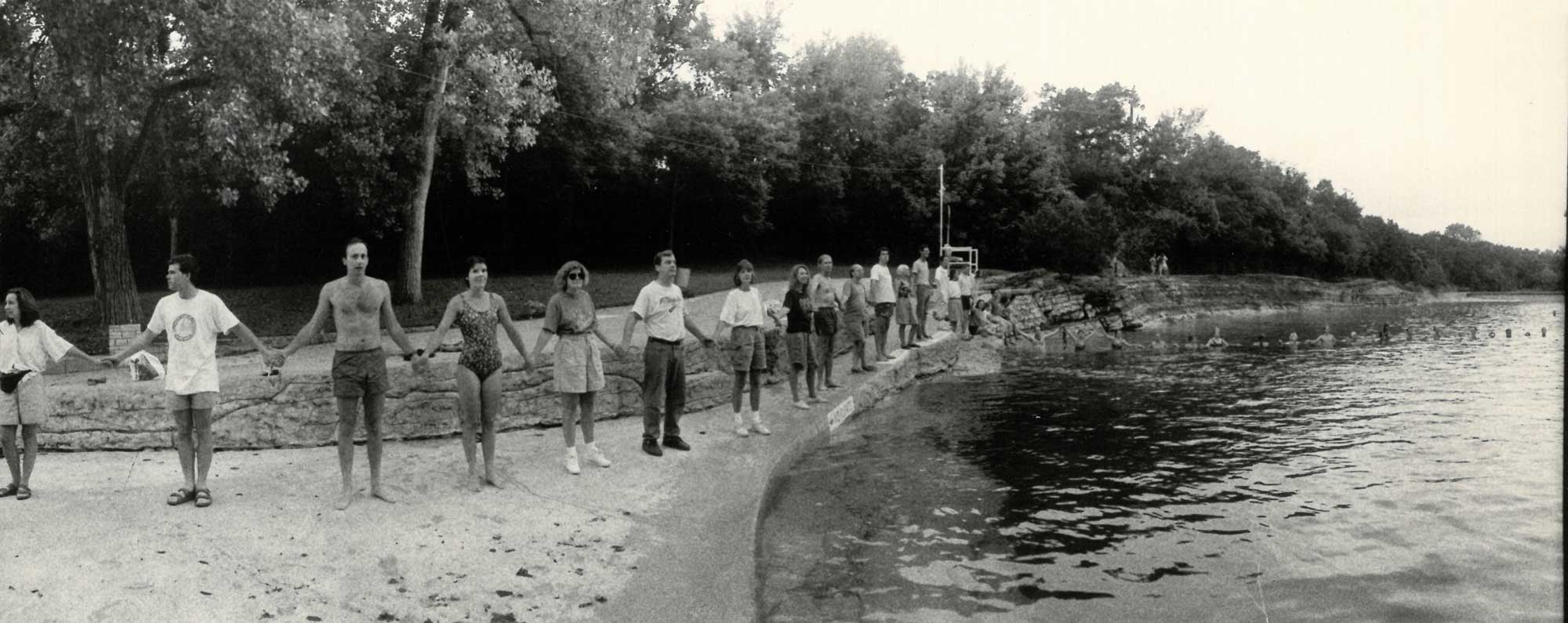 Photo of a human chain across Barton Creek