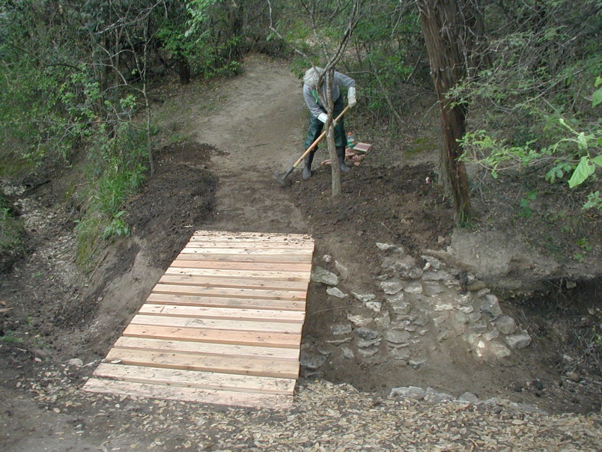 The trail leading to the bridge is leveled.